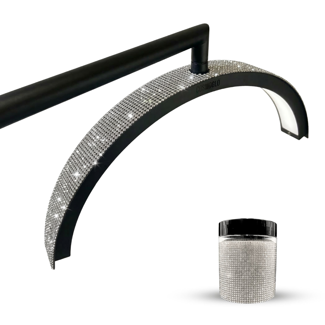 Sparkling diamond accent gems from The CosmoGlo accessories collection on a festive holiday-themed background.