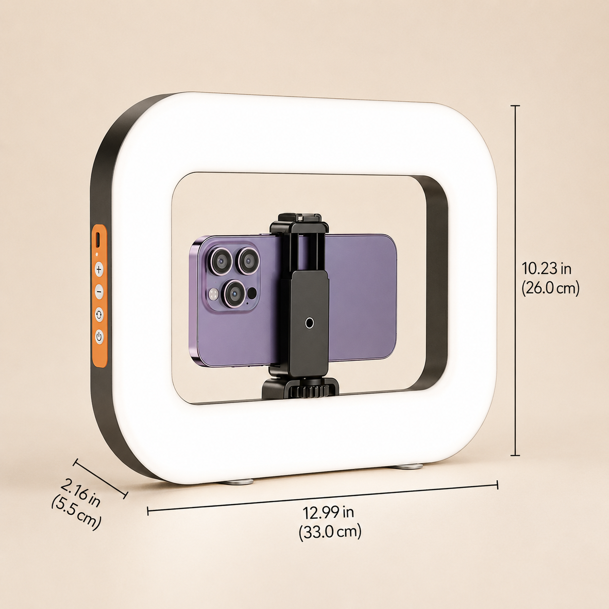 A square LED ring light with a white illuminated frame and black outer trim, shown with overlaid dimension lines and measurements on a beige background. A purple smartphone is mounted inside the ring on a small black stand.