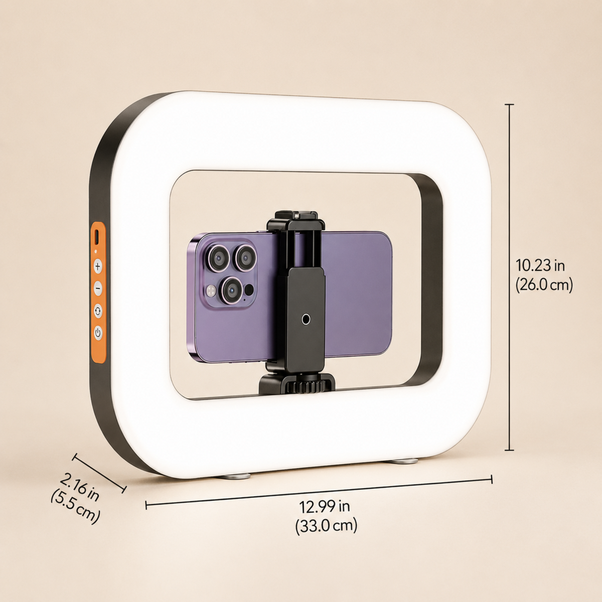 A square LED ring light with a white illuminated frame and black outer trim, shown with overlaid dimension lines and measurements on a beige background. A purple smartphone is mounted inside the ring on a small black stand.