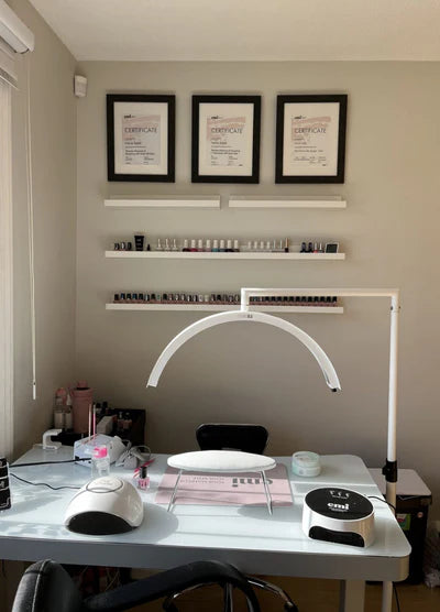 CosmoGlo LED nail lamp on a nail table - White.