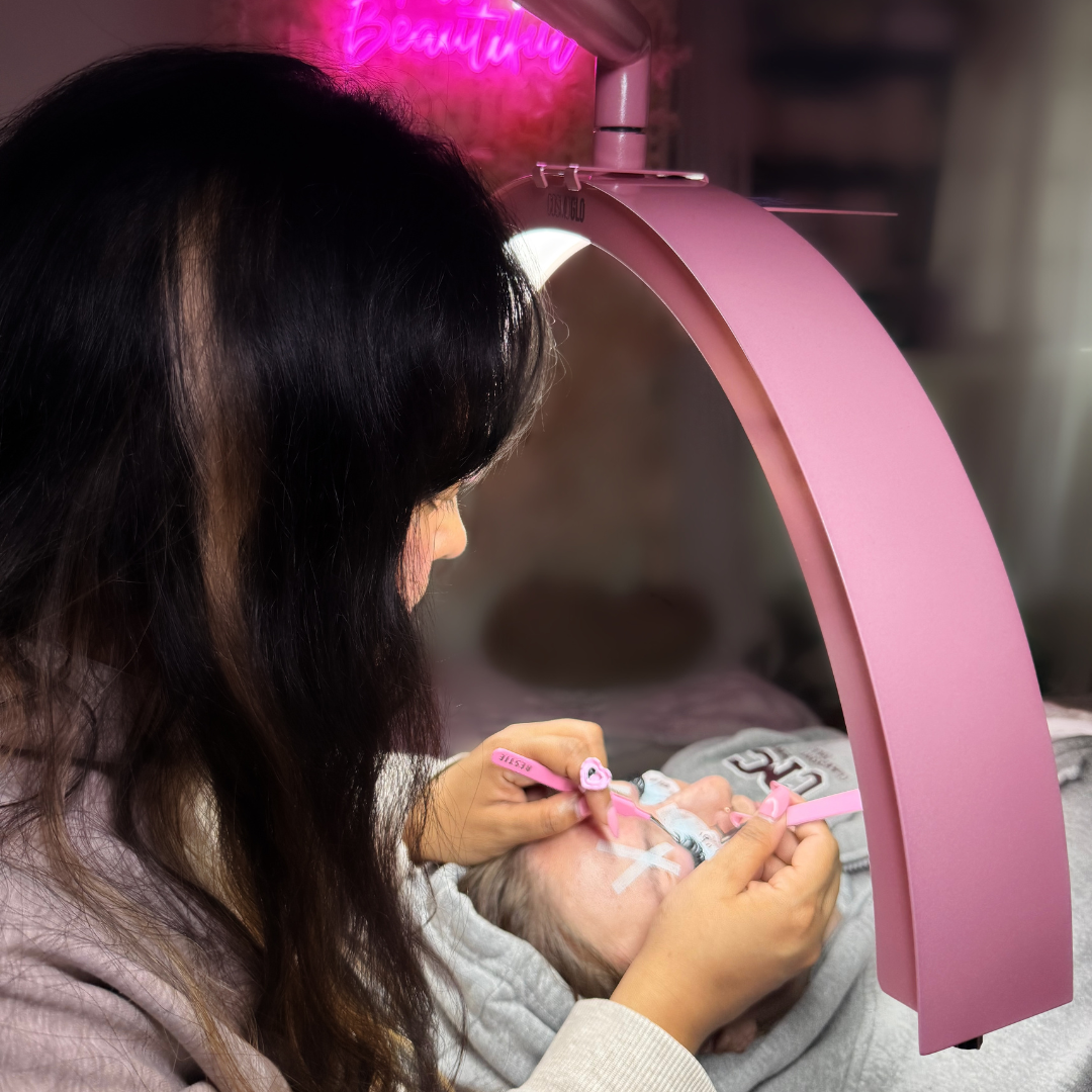 Artist working under the CosmoGlo half-moon light