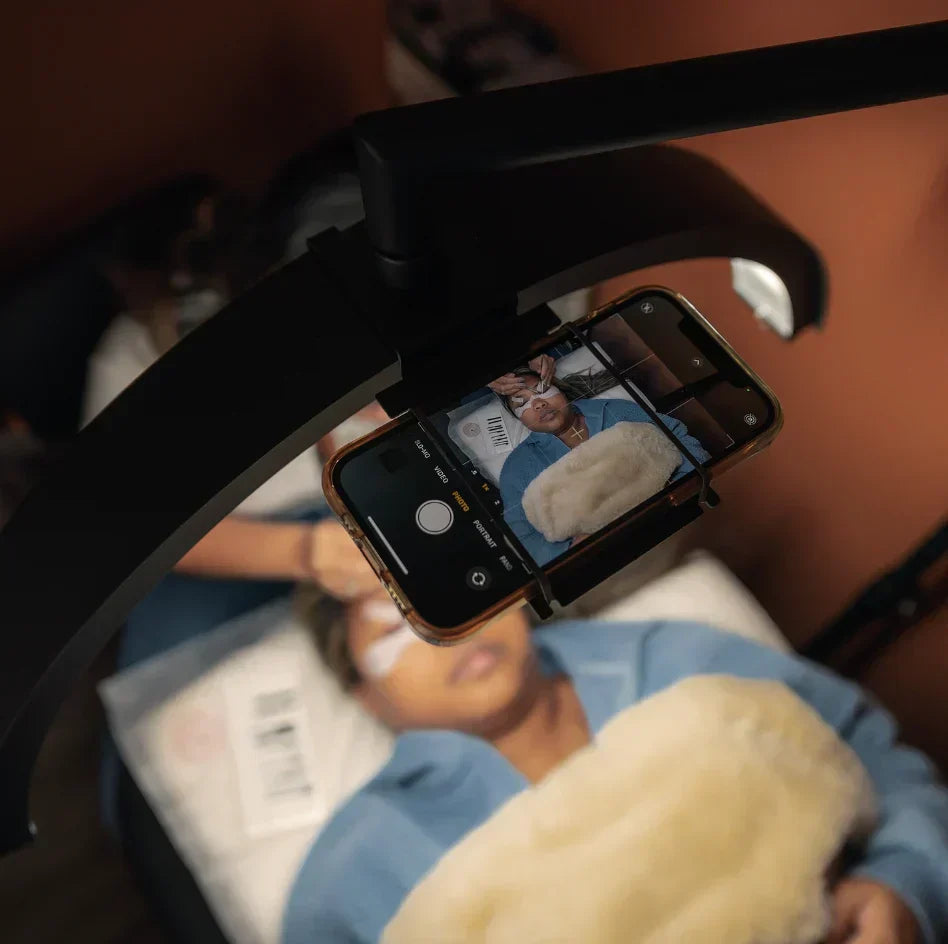 Artist recording content using CosmoGlo phone holder