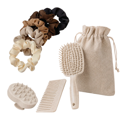 Set of hair care products including scrunchies, a brush, and a comb on a white background.