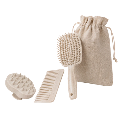 Set of beige hair care tools including a brush, comb, and scrubber with a drawstring bag on a white background.