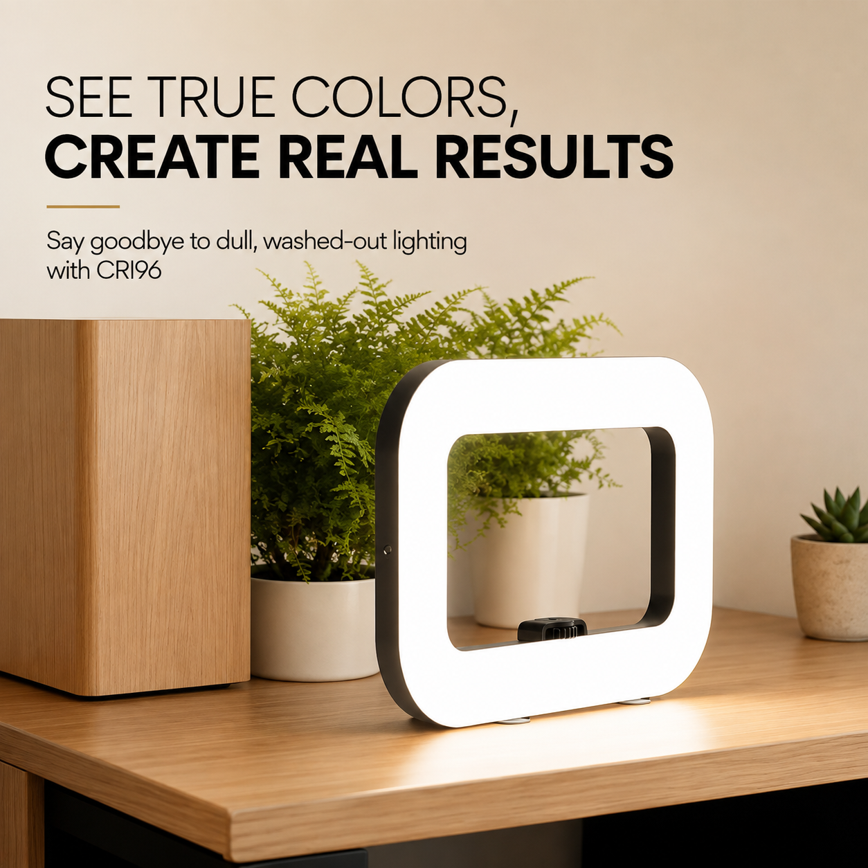 A square-shaped white LED ring light with a black side frame stands on a wooden desk in a styled room setting with potted plants and a wooden cabinet, under the text &