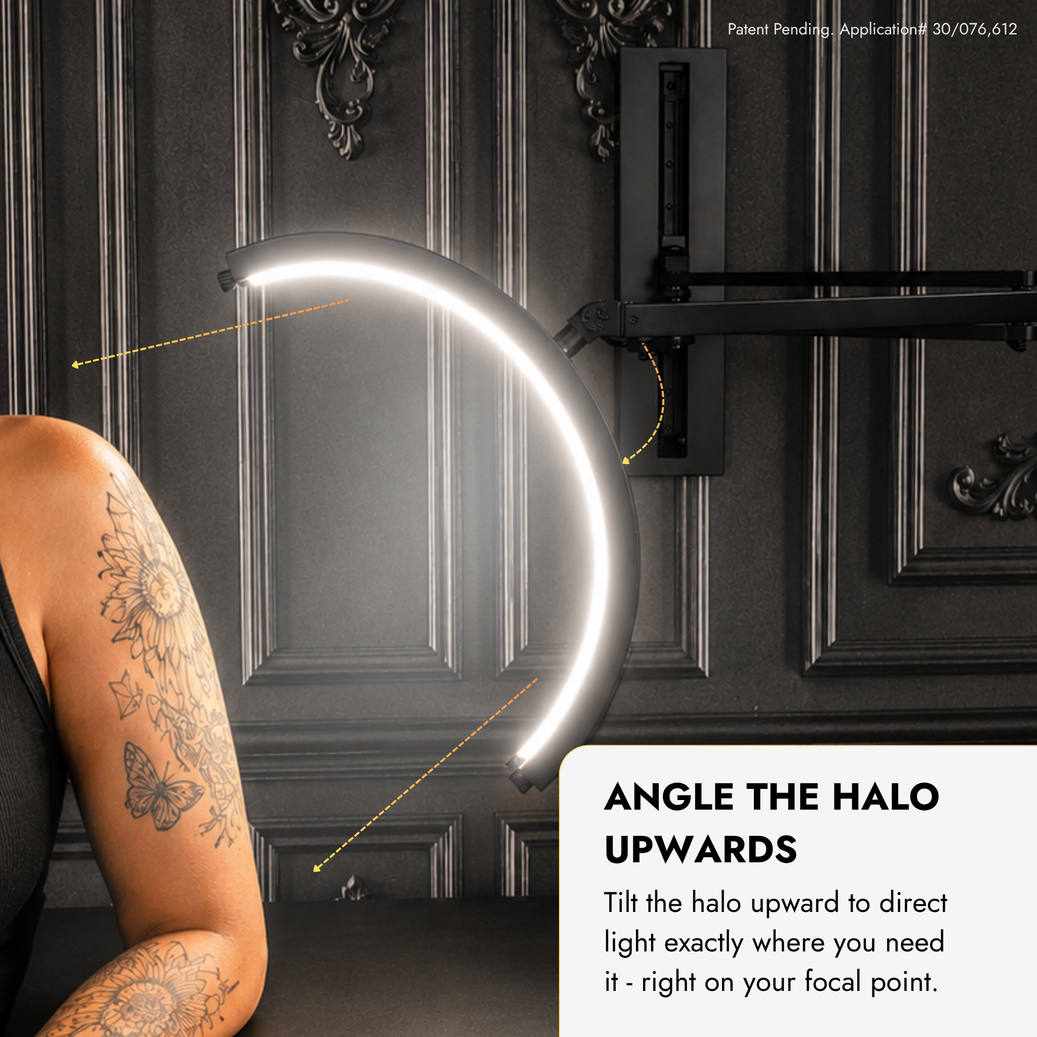 A curved LED halo light mounted on a dark paneled wall, shown with a tattooed person&