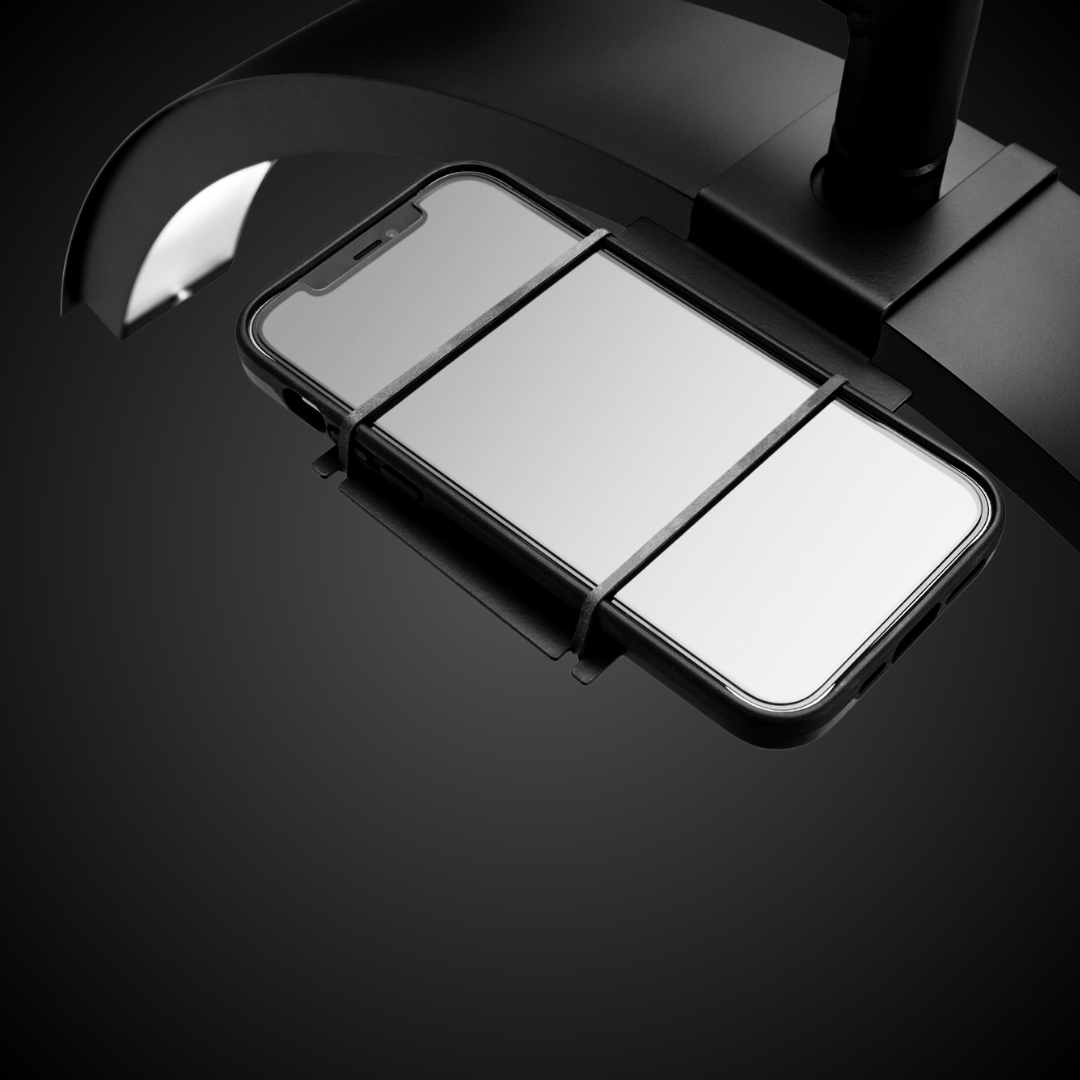 CosmoGlo phone clip and phone holder for CosmoGlo lights to film hands free while they work clients. Easy access to to clip on or remove easily with an overview angle