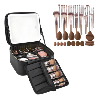 An open black makeup organizer case shown with makeup inside and a separate set of makeup brushes and sponges arranged to the right. The case has a built-in mirror on the inside lid and a roll-out brush holder.