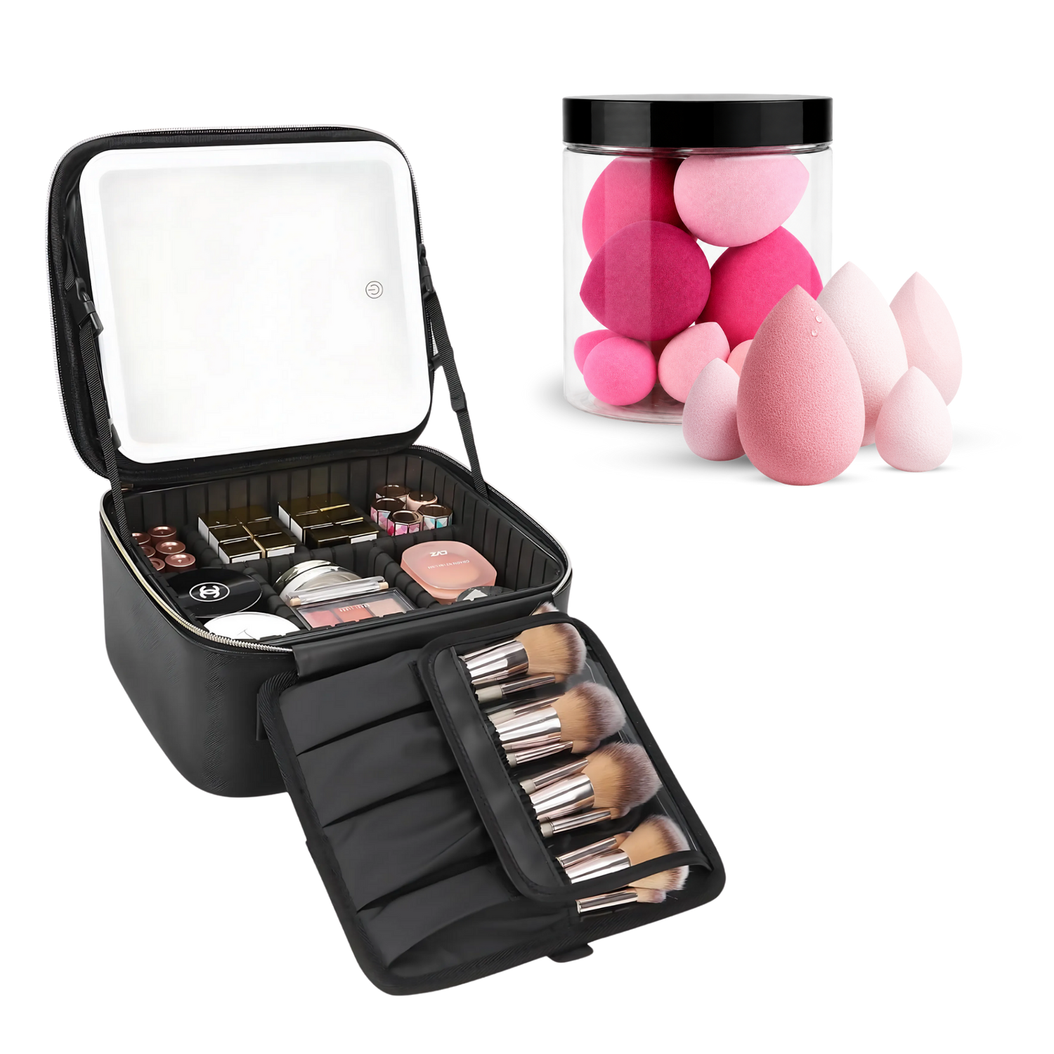 An open black makeup organizer case shown on a white background, with a mirror on the inside lid, makeup items in the main compartment, brush handles in an attached roll-out section, and several pink teardrop makeup sponges displayed beside it in a clear jar.