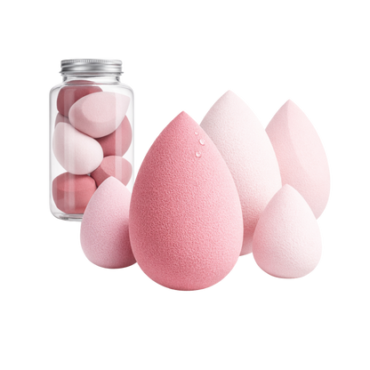 Pink makeup sponges and a container on a white background