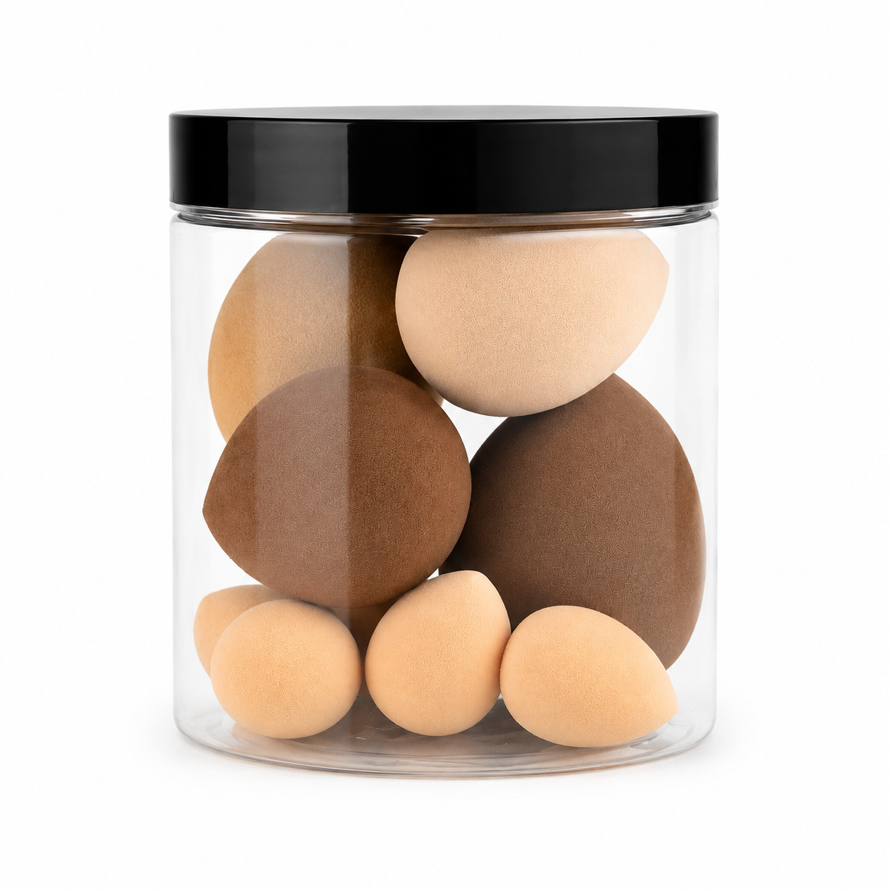A clear cylindrical jar with a black lid containing multiple makeup sponge applicators in light beige and medium brown shades, shown on a white background.